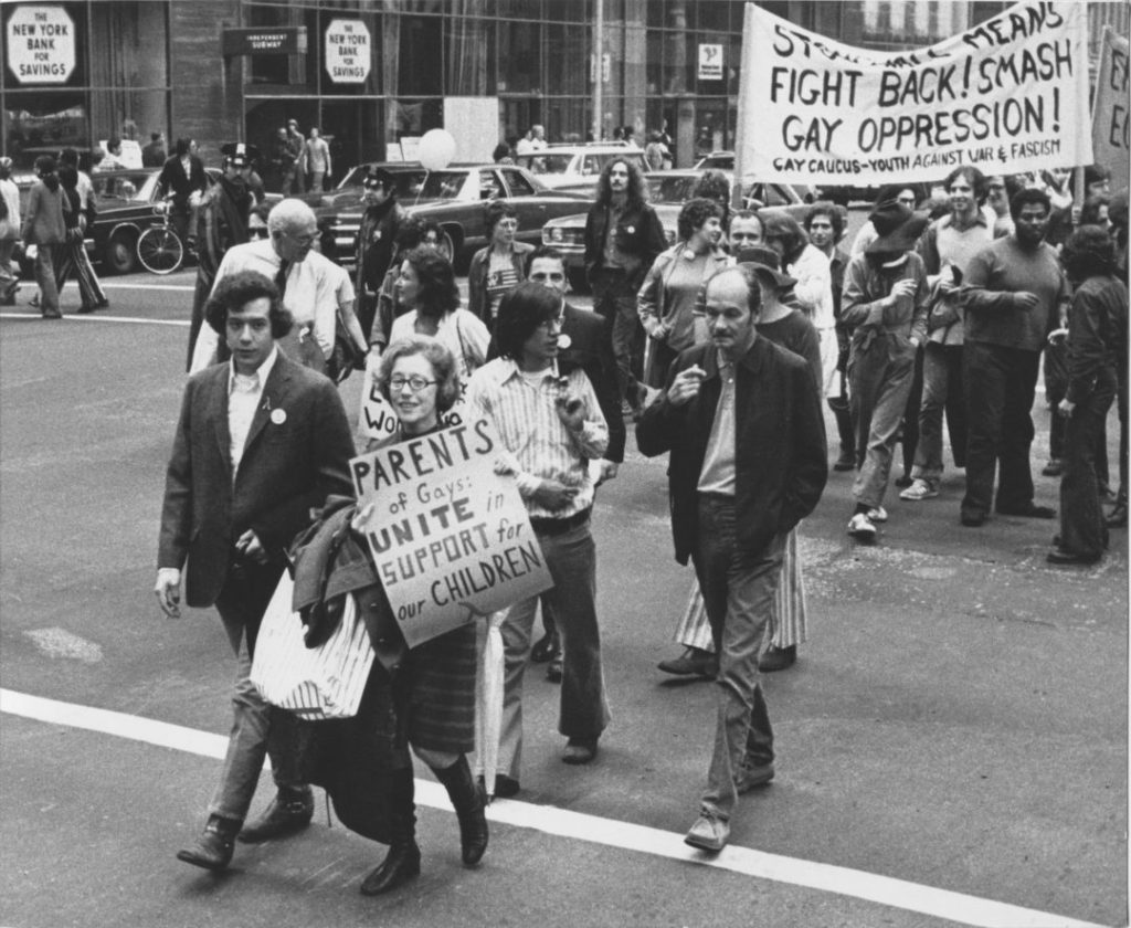 Photograph of Jeanne and Morty Manford marching in Christoper Street Liberation Day Parade in 1972.